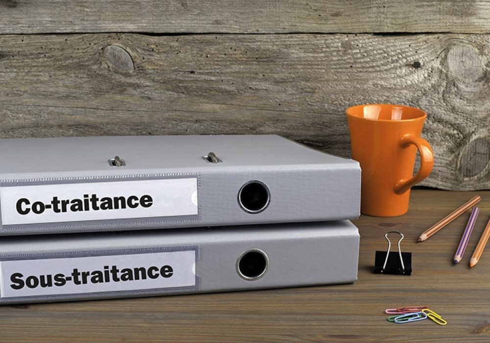 Insourcing and Outsourcing - two folders on wooden office desk