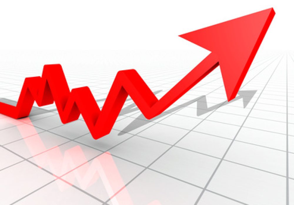 Business Graph with arrow showing profits and gains on a white reflective background